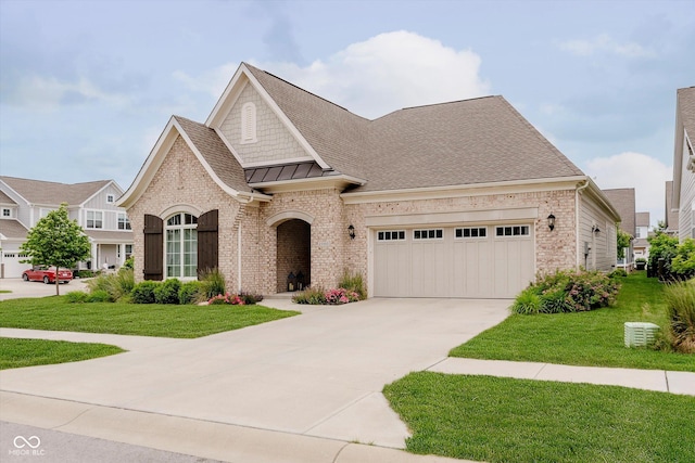15593 Marsden Dr, Westfield, IN 46074 - french provincial home with a garage, concrete driveway, brick siding, a front yard, and a shingled roof