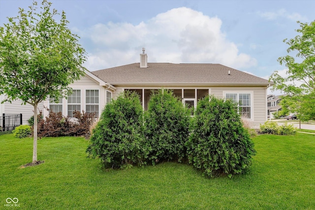 15593 Marsden Dr, Westfield, IN 46074 - rear view of property featuring a chimney, a lawn, and roof with shingles