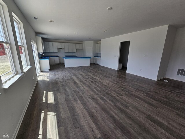 2271 Oakmont Dr, Plainfield, IN 46168 - unfurnished living room featuring dark wood-style floors and recessed lighting