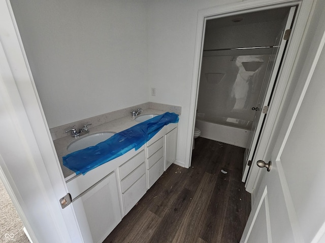 2271 Oakmont Dr, Plainfield, IN 46168 - bathroom featuring wood finished floors, double vanity, and washtub / shower combination