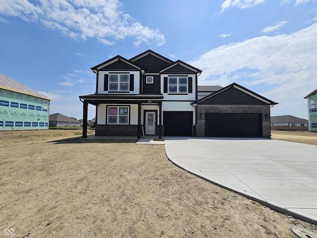 2271 Oakmont Dr, Plainfield, IN 46168 - view of front facade with concrete driveway, brick siding, an attached garage, and covered porch