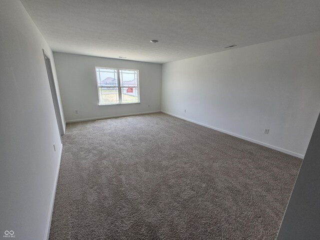 2271 Oakmont Dr, Plainfield, IN 46168 - carpeted empty room with baseboards