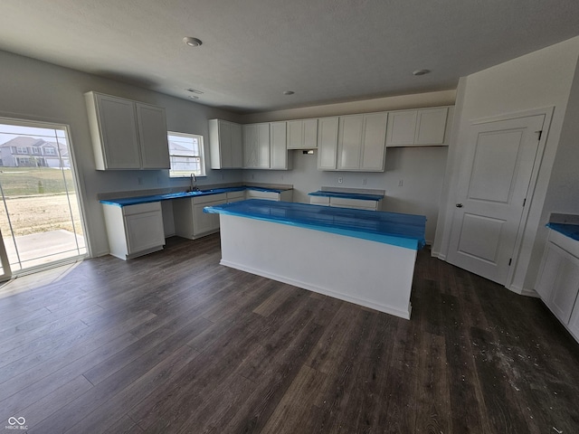 2271 Oakmont Dr, Plainfield, IN 46168 - kitchen with dark wood-style floors, white cabinets, and a kitchen island