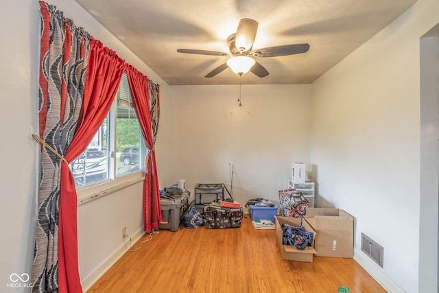 2445 S Bolton Ave, Indianapolis, IN 46203 - empty room with a ceiling fan, wood finished floors, and baseboards