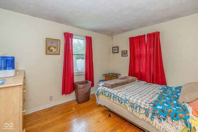 2445 S Bolton Ave, Indianapolis, IN 46203 - bedroom with wood finished floors and baseboards
