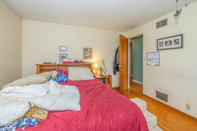 2445 S Bolton Ave, Indianapolis, IN 46203 - bedroom with wood finished floors and baseboards