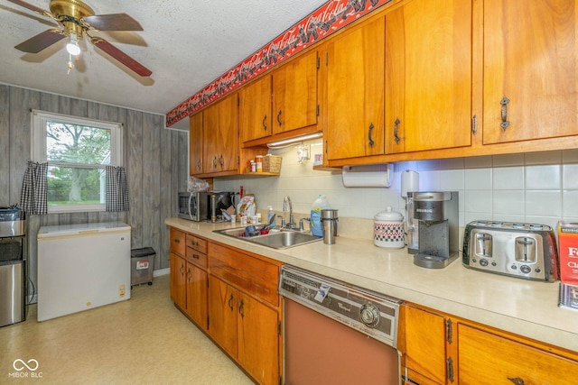 2445 S Bolton Ave, Indianapolis, IN 46203 - kitchen with dishwasher, refrigerator, light countertops, a sink, and tasteful backsplash