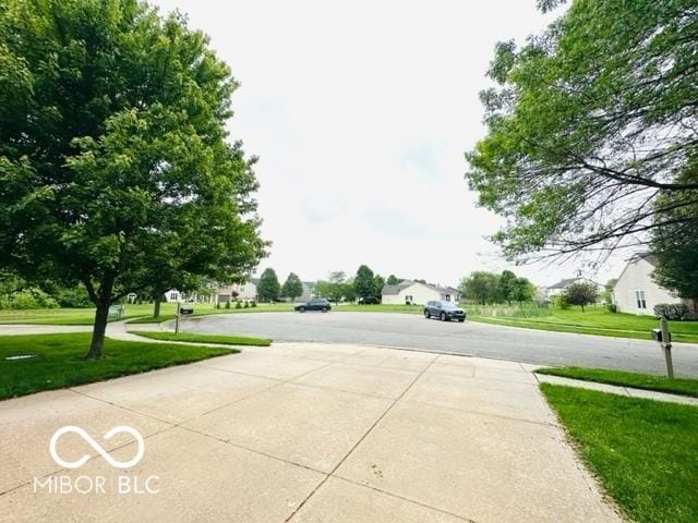7312 Drum Castle Ct, Indianapolis, IN 46259 - view of concrete driveway with sidewalks