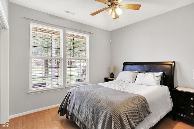 7312 Drum Castle Ct, Indianapolis, IN 46259 - bedroom with wood finished floors, baseboards, and ceiling fan