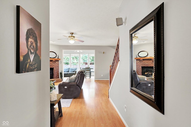 7312 Drum Castle Ct, Indianapolis, IN 46259 - hall with light wood-style floors, baseboards, and stairway