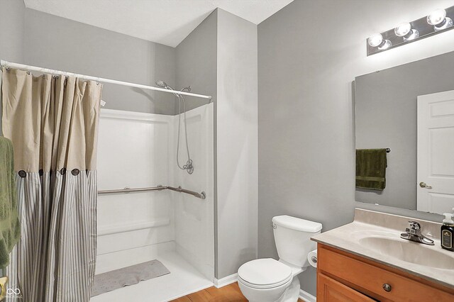 7312 Drum Castle Ct, Indianapolis, IN 46259 - full bathroom featuring a shower with curtain, vanity, toilet, and baseboards