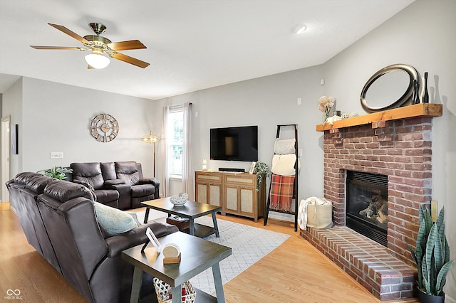 7312 Drum Castle Ct, Indianapolis, IN 46259 - living room featuring a fireplace, light wood-style floors, and ceiling fan