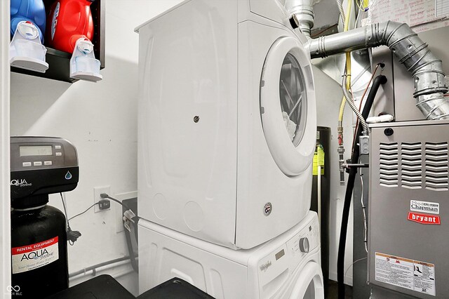 7312 Drum Castle Ct, Indianapolis, IN 46259 - laundry area featuring stacked washer and clothes dryer