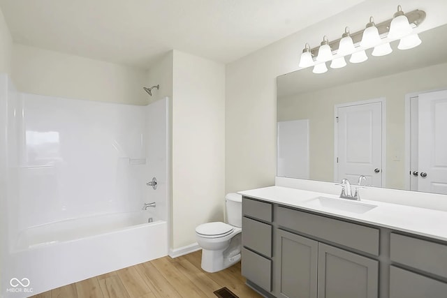 3927 Wren Dr, Brownsburg, IN 46112 - full bath featuring wood finished floors, vanity, bathing tub / shower combination, toilet, and baseboards