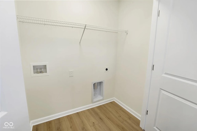 3927 Wren Dr, Brownsburg, IN 46112 - laundry area with hookup for an electric dryer, washer hookup, baseboards, and light wood-type flooring