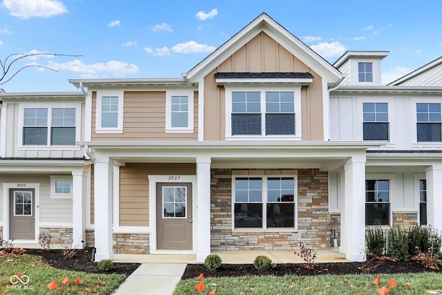 3927 Wren Dr, Brownsburg, IN 46112 - view of front of property with board and batten siding, stone siding, and covered porch
