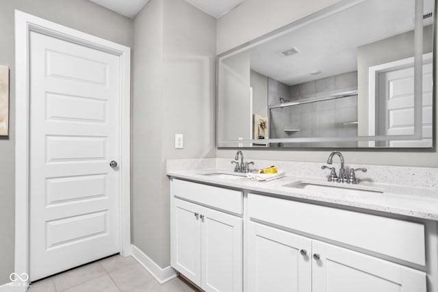 11588 Brooks Farm Blvd, Noblesville, IN 46060 - full bathroom featuring double vanity, tile patterned flooring, and a tile shower