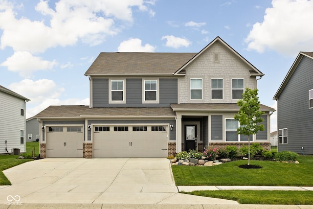 11588 Brooks Farm Blvd, Noblesville, IN 46060 - craftsman-style house featuring brick siding, concrete driveway, a front yard, a garage, and roof with shingles