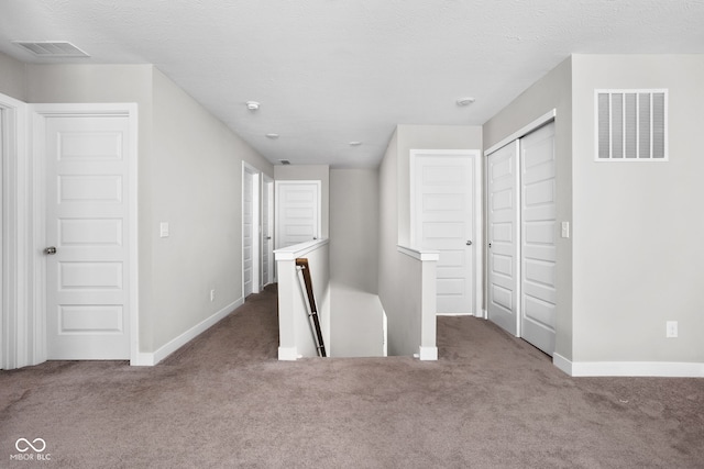11588 Brooks Farm Blvd, Noblesville, IN 46060 - corridor with an upstairs landing and carpet