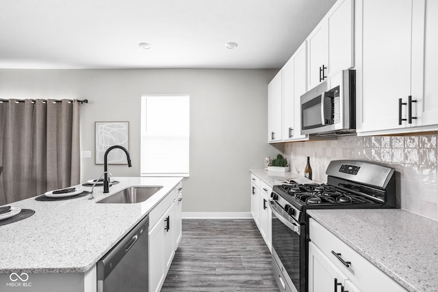 11588 Brooks Farm Blvd, Noblesville, IN 46060 - kitchen with stainless steel appliances, dark wood-style floors, tasteful backsplash, and light stone countertops