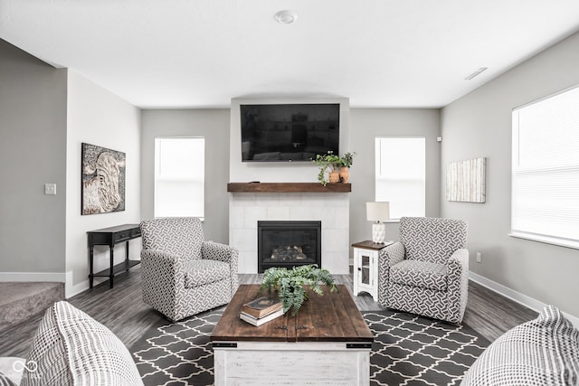 11588 Brooks Farm Blvd, Noblesville, IN 46060 - living room featuring dark wood-style flooring and a tiled fireplace
