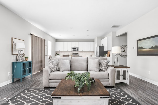 11588 Brooks Farm Blvd, Noblesville, IN 46060 - living room featuring dark wood-style flooring and baseboards