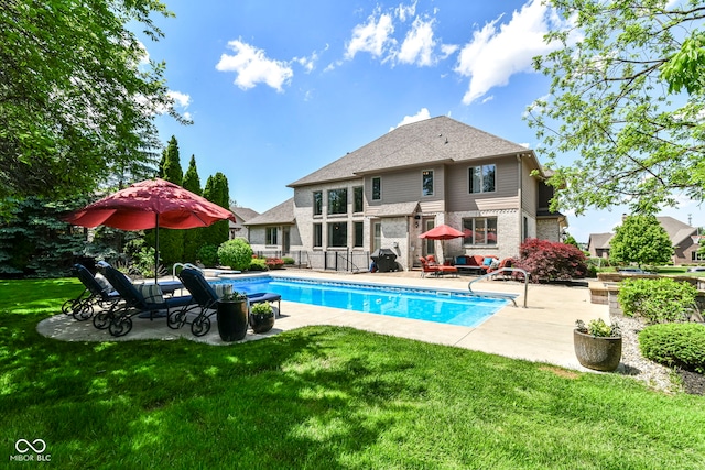 13909 Waterway Blvd, Fishers, IN 46040 - rear view of property featuring a patio area, a lawn, and brick siding