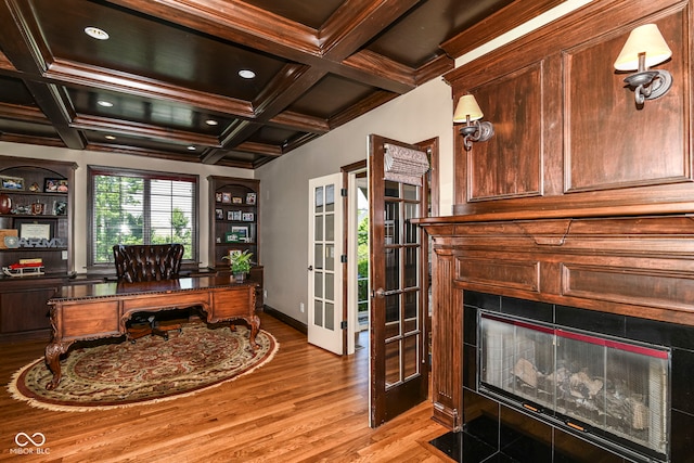 13909 Waterway Blvd, Fishers, IN 46040 - home office with light wood-type flooring, french doors, a fireplace with flush hearth, beam ceiling, and coffered ceiling