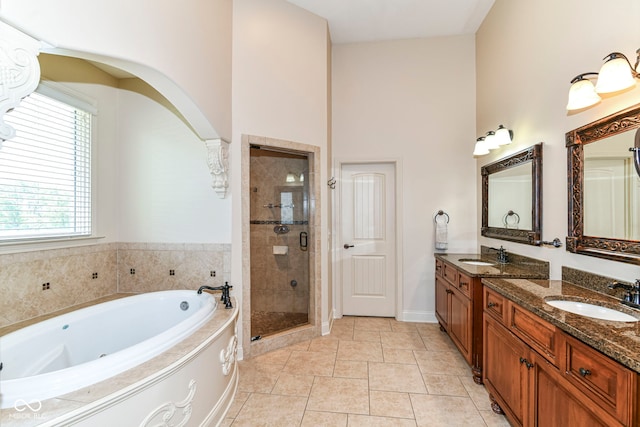 13909 Waterway Blvd, Fishers, IN 46040 - full bath with a shower stall, a tub with jets, double vanity, baseboards, and tile patterned floors