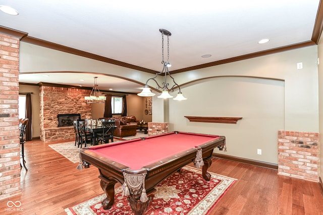 13909 Waterway Blvd, Fishers, IN 46040 - rec room with crown molding, wood finished floors, billiards, a fireplace, and baseboards