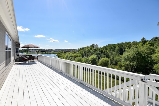 6110 Pelican Ln, Columbus, IN 47201 - wooden terrace featuring outdoor dining area and a water view