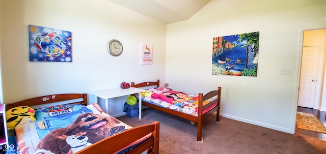 6110 Pelican Ln, Columbus, IN 47201 - carpeted bedroom featuring vaulted ceiling and baseboards