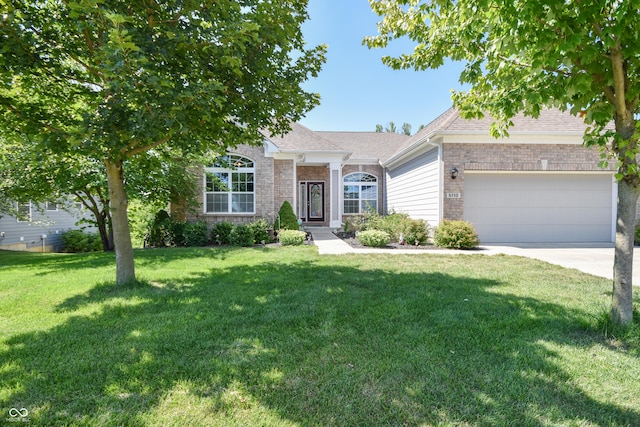 6110 Pelican Ln, Columbus, IN 47201 - view of front of house with a garage, a front yard, concrete driveway, and roof with shingles