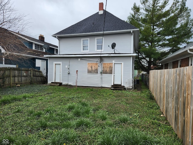 323-325 N Gladstone Ave, Indianapolis, IN 46201 - back of property with entry steps and a shingled roof