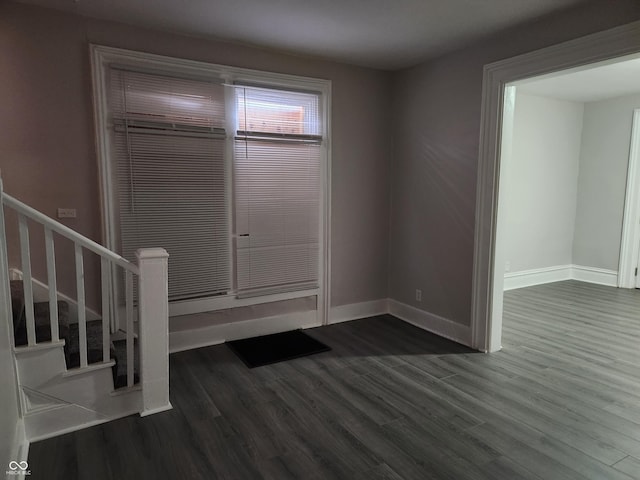 323-325 N Gladstone Ave, Indianapolis, IN 46201 - unfurnished bedroom with dark wood-type flooring and baseboards