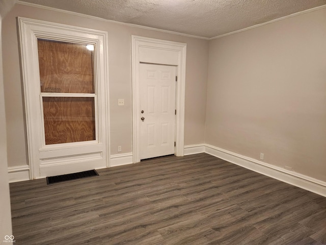 323-325 N Gladstone Ave, Indianapolis, IN 46201 - empty room featuring dark wood-style floors, a textured ceiling, baseboards, and crown molding