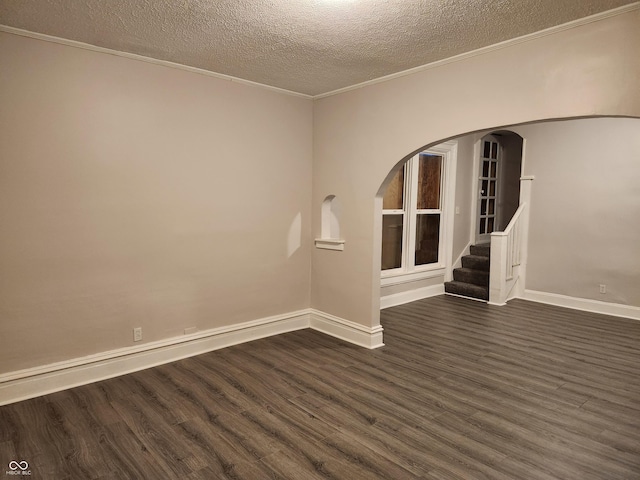 323-325 N Gladstone Ave, Indianapolis, IN 46201 - empty room with a textured ceiling, dark wood-style floors, ornamental molding, baseboards, and stairway