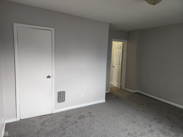 323-325 N Gladstone Ave, Indianapolis, IN 46201 - unfurnished bedroom featuring carpet and baseboards