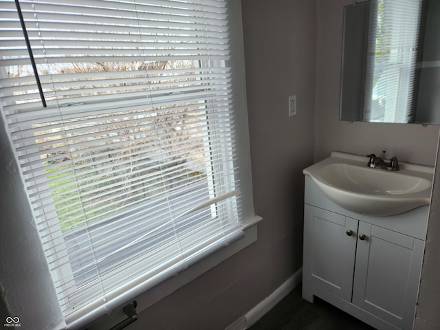 323-325 N Gladstone Ave, Indianapolis, IN 46201 - bathroom featuring healthy amount of natural light, vanity, and baseboards
