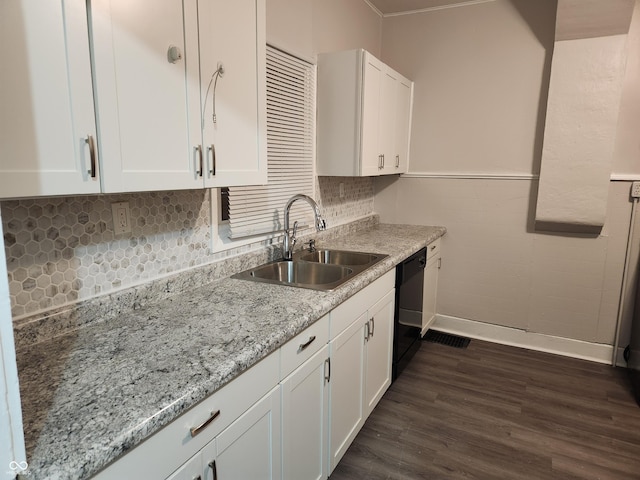 323-325 N Gladstone Ave, Indianapolis, IN 46201 - kitchen featuring a sink, black dishwasher, dark wood-style floors, white cabinetry, and a wainscoted wall