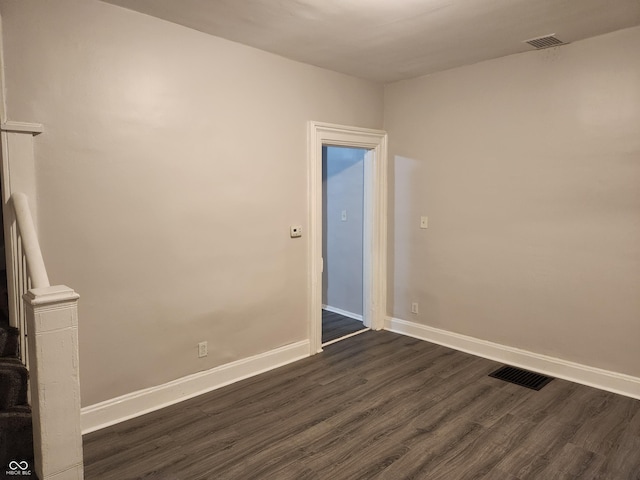 323-325 N Gladstone Ave, Indianapolis, IN 46201 - unfurnished room with dark wood-style flooring and baseboards