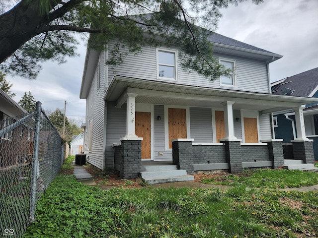 323-325 N Gladstone Ave, Indianapolis, IN 46201 - traditional style home featuring central AC unit and covered porch