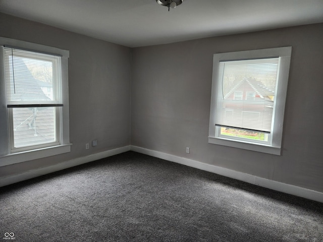 323-325 N Gladstone Ave, Indianapolis, IN 46201 - spare room featuring dark carpet and baseboards
