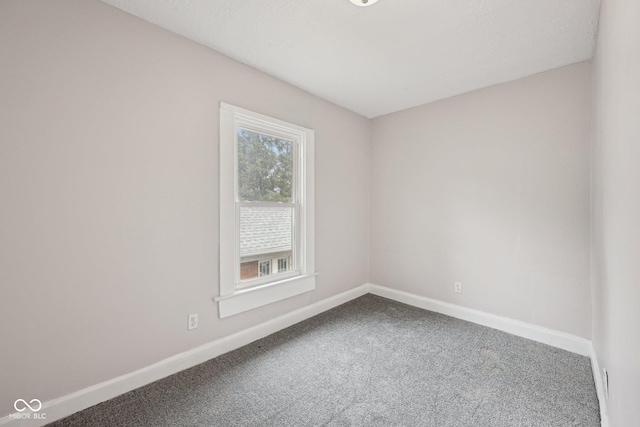 323-325 N Gladstone Ave, Indianapolis, IN 46201 - empty room featuring baseboards and carpet floors