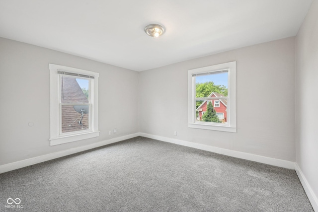 323-325 N Gladstone Ave, Indianapolis, IN 46201 - carpeted spare room with plenty of natural light and baseboards
