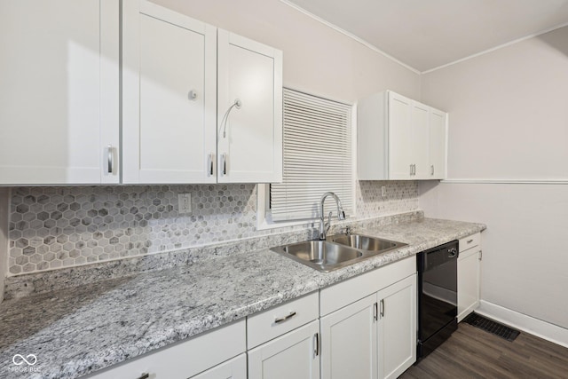 323-325 N Gladstone Ave, Indianapolis, IN 46201 - kitchen featuring a sink, dishwasher, white cabinets, crown molding, and dark wood finished floors