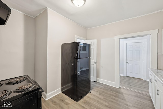 323-325 N Gladstone Ave, Indianapolis, IN 46201 - kitchen with black appliances, crown molding, light wood-style floors, white cabinetry, and baseboards