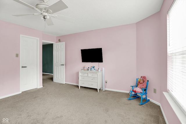 9001 Harrison Run Ct, Indianapolis, IN 46256 - rec room with carpet flooring, a ceiling fan, and baseboards