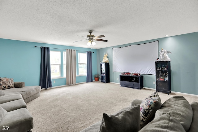 9001 Harrison Run Ct, Indianapolis, IN 46256 - home theater room featuring ceiling fan, carpet flooring, a textured ceiling, and baseboards