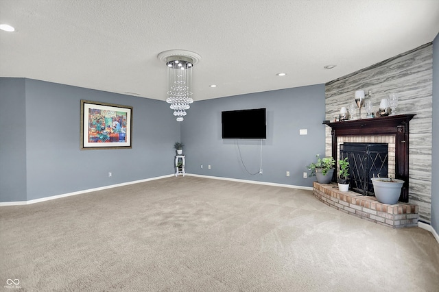 9001 Harrison Run Ct, Indianapolis, IN 46256 - unfurnished living room with carpet flooring, baseboards, a textured ceiling, a brick fireplace, and recessed lighting